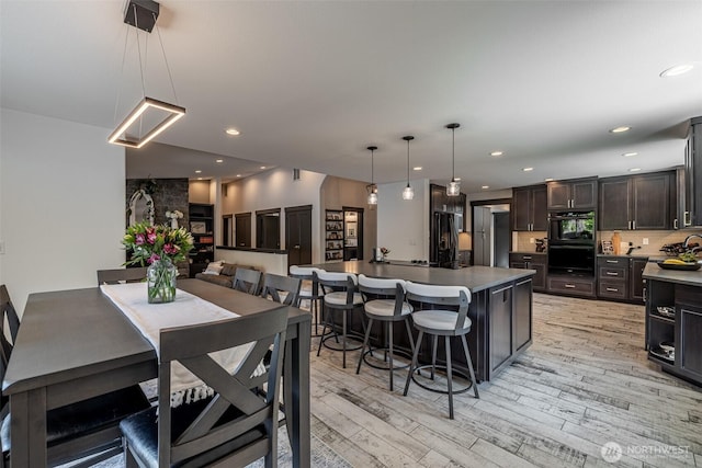 628 Meadows Dr, Wenatchee, WA 98801 - dining room with light wood-style flooring and recessed lighting