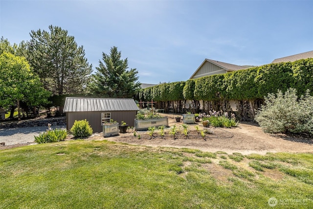 628 Meadows Dr, Wenatchee, WA 98801 - view of grassy yard with a vegetable garden and an outdoor structure