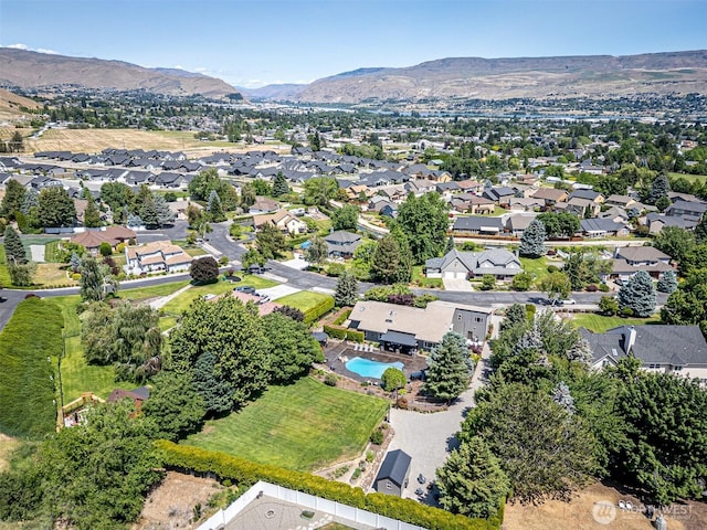 628 Meadows Dr, Wenatchee, WA 98801 - aerial perspective of suburban area featuring a mountain backdrop and a pool area