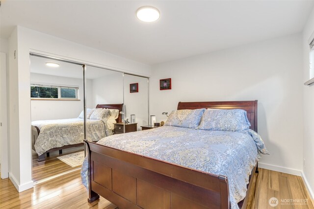 732 11th Ave E Unit 202, Seattle, WA 98102 - bedroom featuring light wood-style floors, a closet, and baseboards