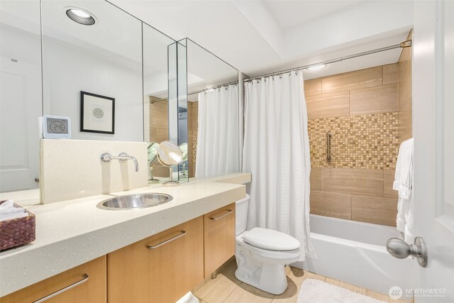 732 11th Ave E Unit 202, Seattle, WA 98102 - full bath featuring vanity, toilet, shower / bath combo with shower curtain, and tile patterned flooring