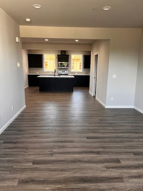 12092 126th Avenue Ct E Unit 70, Puyallup, WA 98374 - unfurnished living room with baseboards, dark wood-style floors, recessed lighting, and a sink