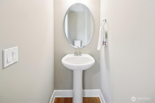 7121 Shinkle Pl SW, Seattle, WA 98106 - bathroom with baseboards and wood finished floors