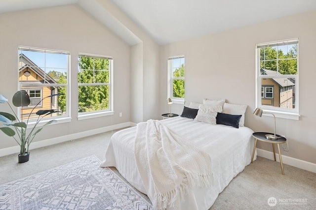 7121 Shinkle Pl SW, Seattle, WA 98106 - carpeted bedroom featuring multiple windows, baseboards, and vaulted ceiling