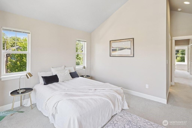 7121 Shinkle Pl SW, Seattle, WA 98106 - carpeted bedroom featuring baseboards and high vaulted ceiling