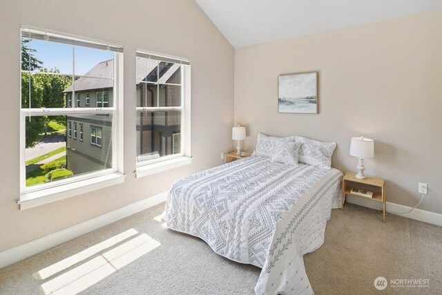 7121 Shinkle Pl SW, Seattle, WA 98106 - carpeted bedroom featuring vaulted ceiling and baseboards