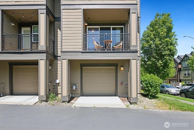 7121 Shinkle Pl SW, Seattle, WA 98106 - view of front of home with a balcony and a garage