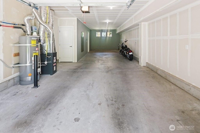 7121 Shinkle Pl SW, Seattle, WA 98106 - garage featuring strapped water heater and a garage door opener