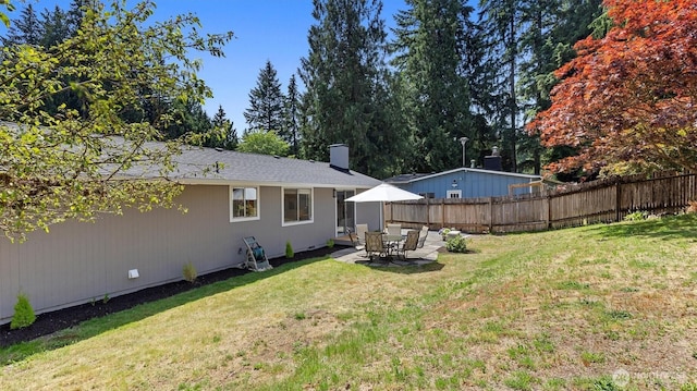 19932 NE 175th St, Woodinville, WA 98077 - rear view of house with a chimney and a patio area