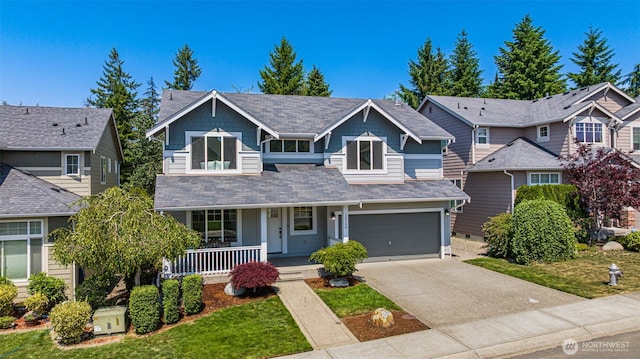 12106 178th Ave E, Bonney Lake, WA 98391 - view of front of house featuring covered porch, driveway, an attached garage, and a front lawn