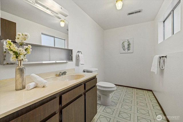 7223 NE 160th St, Kenmore, WA 98028 - bathroom featuring toilet, vanity, tile patterned floors, and baseboards