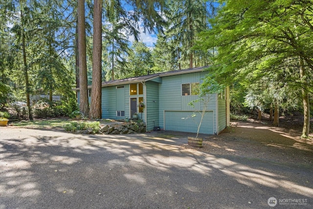 7223 NE 160th St, Kenmore, WA 98028 - view of front of property with driveway and an attached garage
