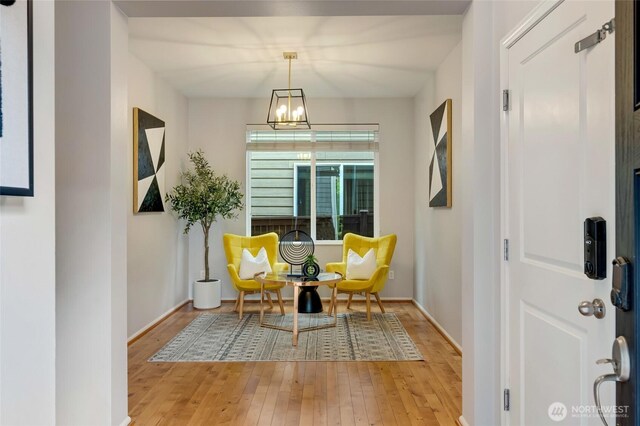 18307 38th Dr SE, Bothell, WA 98012 - living area with light wood-style flooring, a chandelier, and baseboards