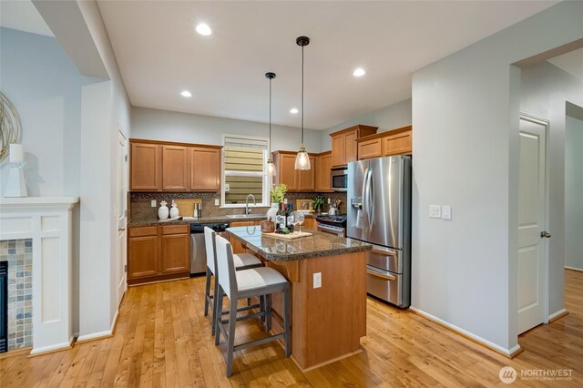 18307 38th Dr SE, Bothell, WA 98012 - kitchen with stainless steel appliances, decorative backsplash, light wood-style floors, and recessed lighting