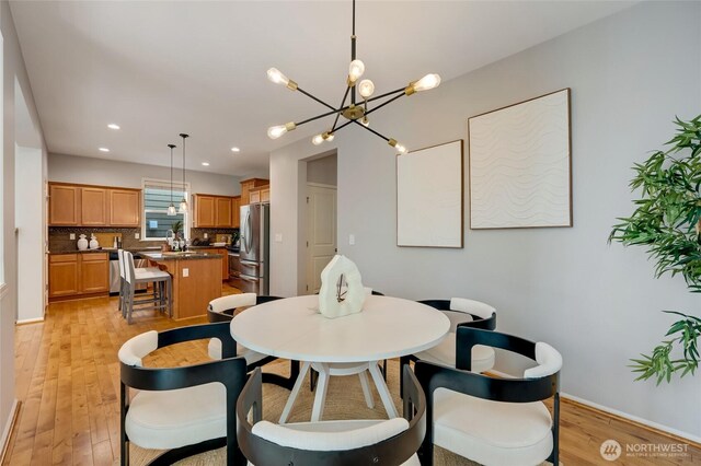 18307 38th Dr SE, Bothell, WA 98012 - dining space featuring light wood-type flooring, a chandelier, recessed lighting, and baseboards