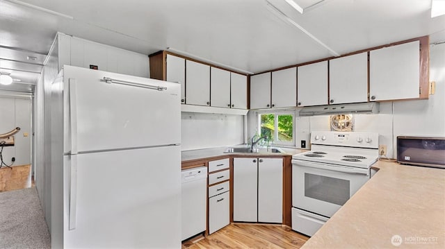 13010 168th St NE, Arlington, WA 98223 - kitchen with white appliances, under cabinet range hood, light countertops, white cabinetry, and light wood-type flooring