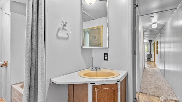 13010 168th St NE, Arlington, WA 98223 - full bathroom featuring vanity, shower / bathtub combination with curtain, and wood finished floors