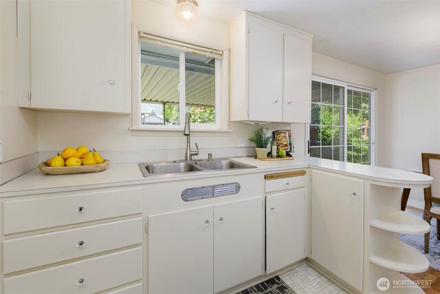 331 E 2nd St, North Bend, WA 98045 - kitchen featuring light countertops, white cabinets, a peninsula, and open shelves
