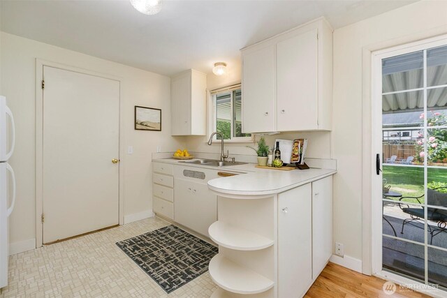 331 E 2nd St, North Bend, WA 98045 - kitchen with light countertops, open shelves, white cabinetry, and freestanding refrigerator
