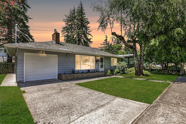331 E 2nd St, North Bend, WA 98045 - ranch-style home featuring an attached garage, a chimney, concrete driveway, and roof with shingles