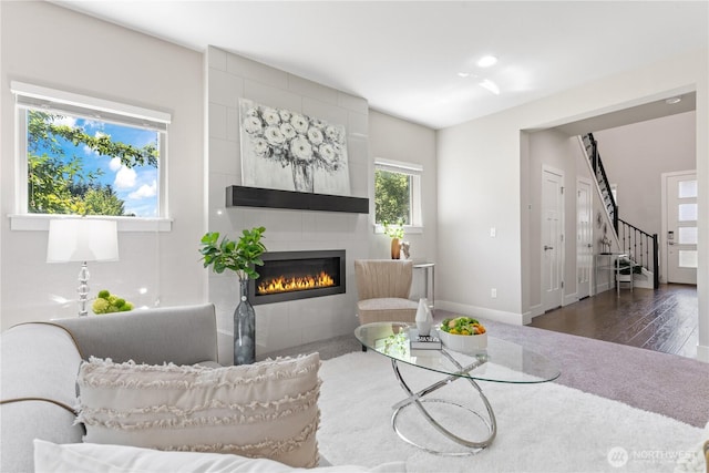 4008 223rd Pl SE, Bothell, WA 98021 - living room featuring a tile fireplace, stairway, wood finished floors, and recessed lighting