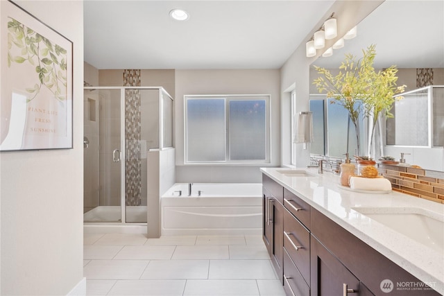 4008 223rd Pl SE, Bothell, WA 98021 - bathroom featuring a bath, a stall shower, double vanity, plenty of natural light, and recessed lighting