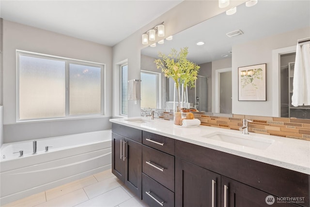 4008 223rd Pl SE, Bothell, WA 98021 - full bath featuring double vanity, decorative backsplash, a garden tub, a shower stall, and tile patterned flooring