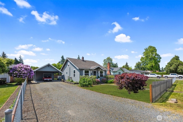 1254 Mchugh Ave, Enumclaw, WA 98022 - view of front of house with a carport, gravel driveway, and a chimney