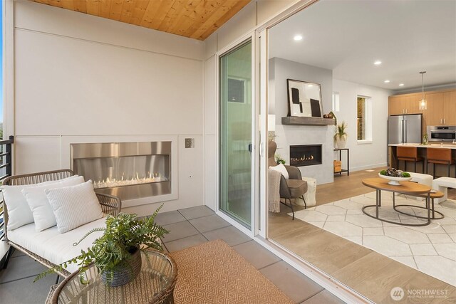 4576 22nd Ave SW, Seattle, WA 98106 - balcony featuring a warm lit fireplace and a sink