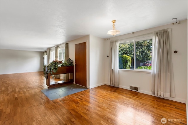 220 Alder Ave, Sumner, WA 98390 - unfurnished room with wood finished floors and baseboards