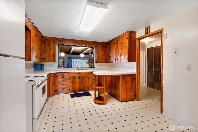 220 Alder Ave, Sumner, WA 98390 - kitchen featuring white appliances, light flooring, and brown cabinets