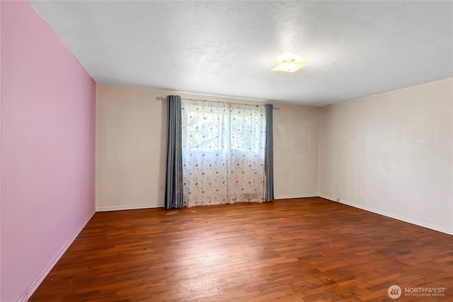 220 Alder Ave, Sumner, WA 98390 - unfurnished room featuring wood finished floors and baseboards