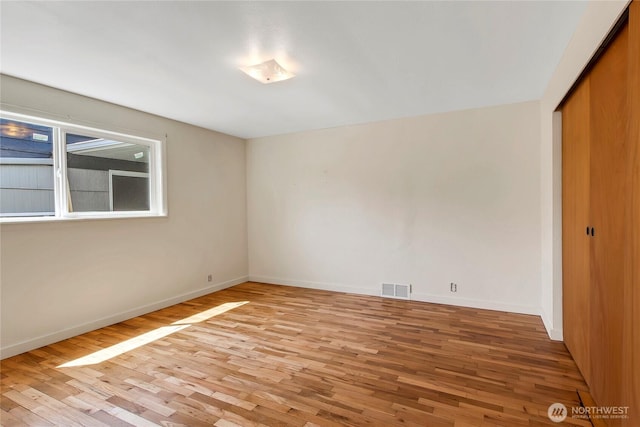 220 Alder Ave, Sumner, WA 98390 - unfurnished bedroom with light wood-type flooring, a closet, and baseboards