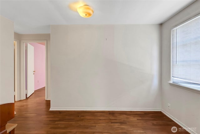 220 Alder Ave, Sumner, WA 98390 - spare room with wood finished floors, healthy amount of natural light, and baseboards