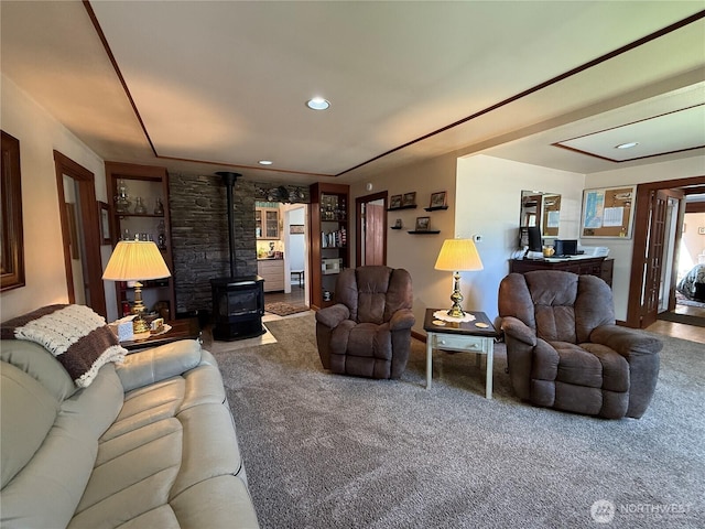 115 15th St SW, Long Beach, WA 98631 - carpeted living room featuring a wood stove and recessed lighting