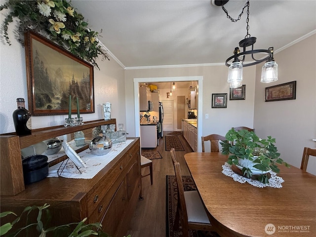 115 15th St SW, Long Beach, WA 98631 - dining space with dark wood-style flooring and crown molding