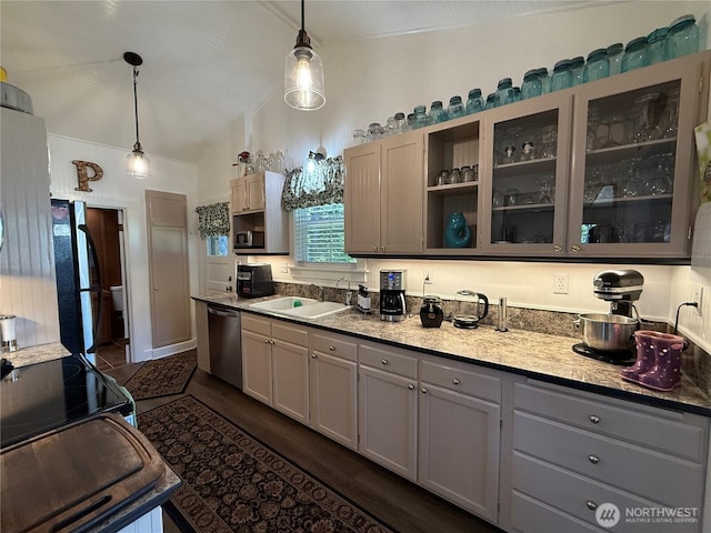 115 15th St SW, Long Beach, WA 98631 - kitchen with a sink, appliances with stainless steel finishes, gray cabinetry, lofted ceiling, and glass insert cabinets