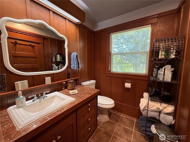 115 15th St SW, Long Beach, WA 98631 - bathroom featuring vanity, toilet, and tile patterned floors