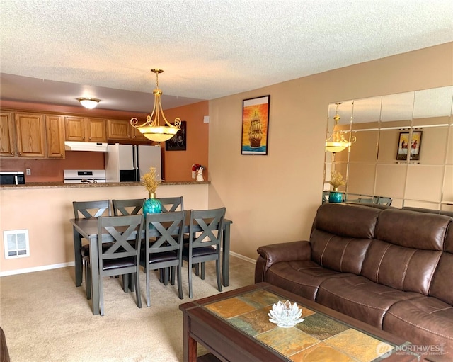 31003 14th Ave S Unit C12, Federal Way, WA 98003 - living area featuring light colored carpet, a textured ceiling, and baseboards