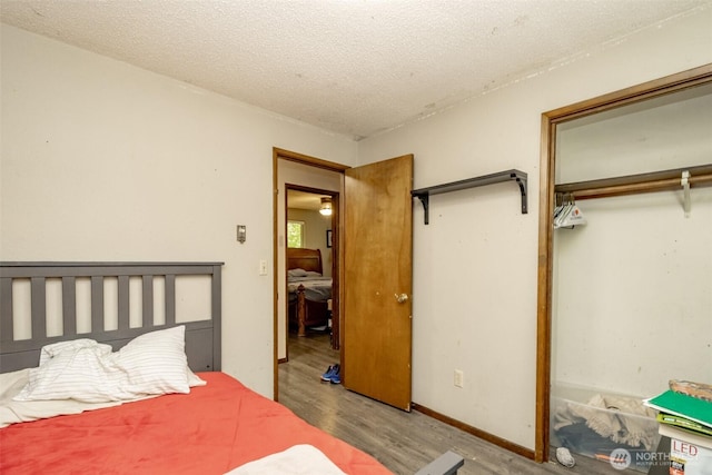 2111 SW Silvan View Ct SW, Olympia, WA 98512 - bedroom featuring a closet, wood finished floors, and a textured ceiling