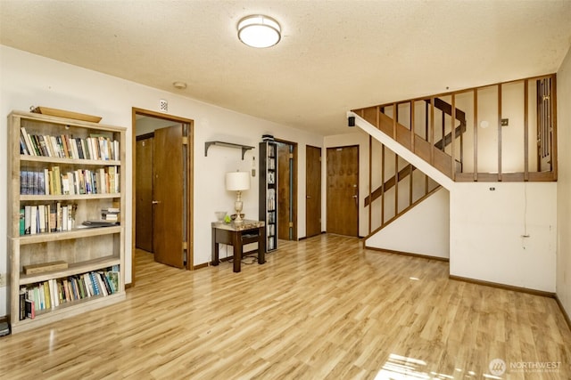2111 SW Silvan View Ct SW, Olympia, WA 98512 - interior space with wood finished floors, stairway, baseboards, and a textured ceiling