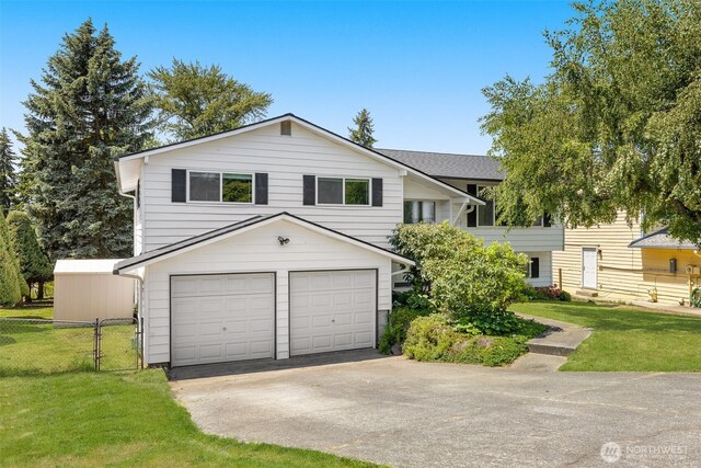 17122 40th Ave W, Lynnwood, WA 98037 - view of front of house featuring concrete driveway and an attached garage