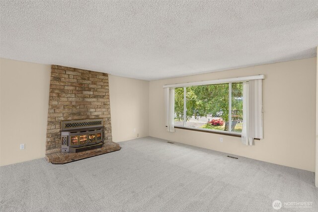 17122 40th Ave W, Lynnwood, WA 98037 - unfurnished living room with carpet flooring and a textured ceiling