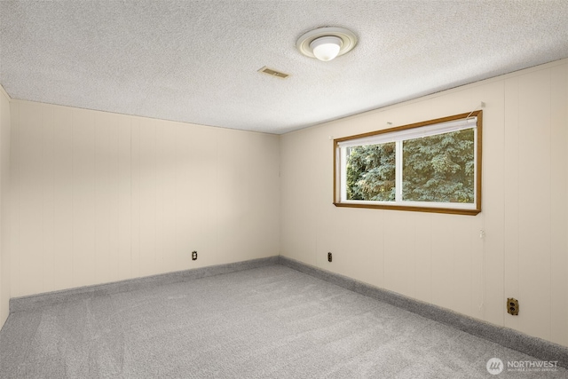 17122 40th Ave W, Lynnwood, WA 98037 - spare room featuring light carpet and a textured ceiling
