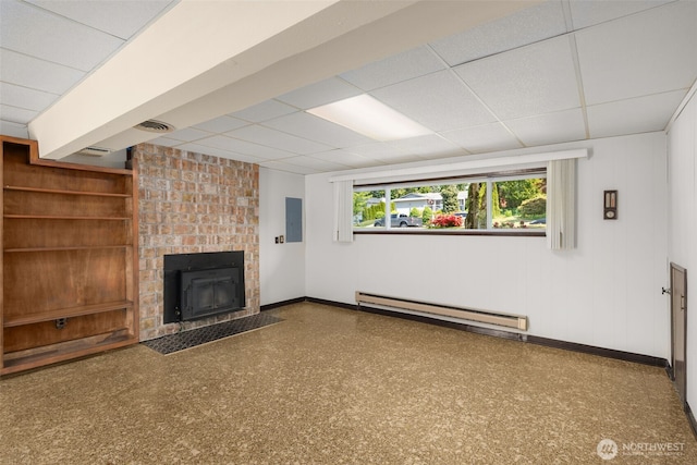 17122 40th Ave W, Lynnwood, WA 98037 - unfurnished living room featuring a drop ceiling, a baseboard heating unit, baseboards, and a fireplace