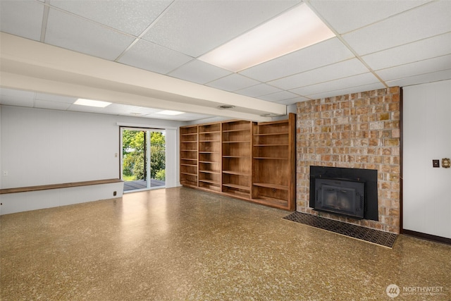 17122 40th Ave W, Lynnwood, WA 98037 - unfurnished living room with a drop ceiling and a brick fireplace