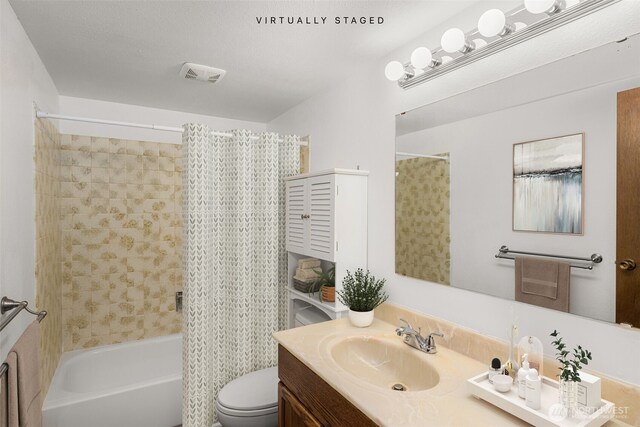 17122 40th Ave W, Lynnwood, WA 98037 - bathroom featuring vanity, shower / bath combo with shower curtain, and toilet