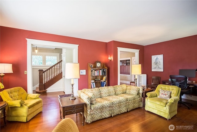 1510 Water St SW, Olympia, WA 98501 - living area with wood finished floors, stairs, and radiator