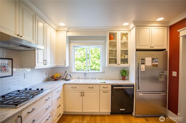 1510 Water St SW, Olympia, WA 98501 - kitchen featuring stainless steel appliances, under cabinet range hood, a sink, backsplash, and recessed lighting