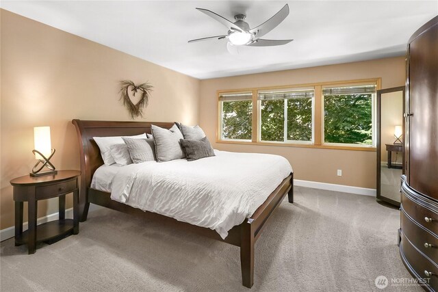 8507 199th Pl SW, Edmonds, WA 98026 - bedroom featuring baseboards, light colored carpet, multiple windows, and a ceiling fan